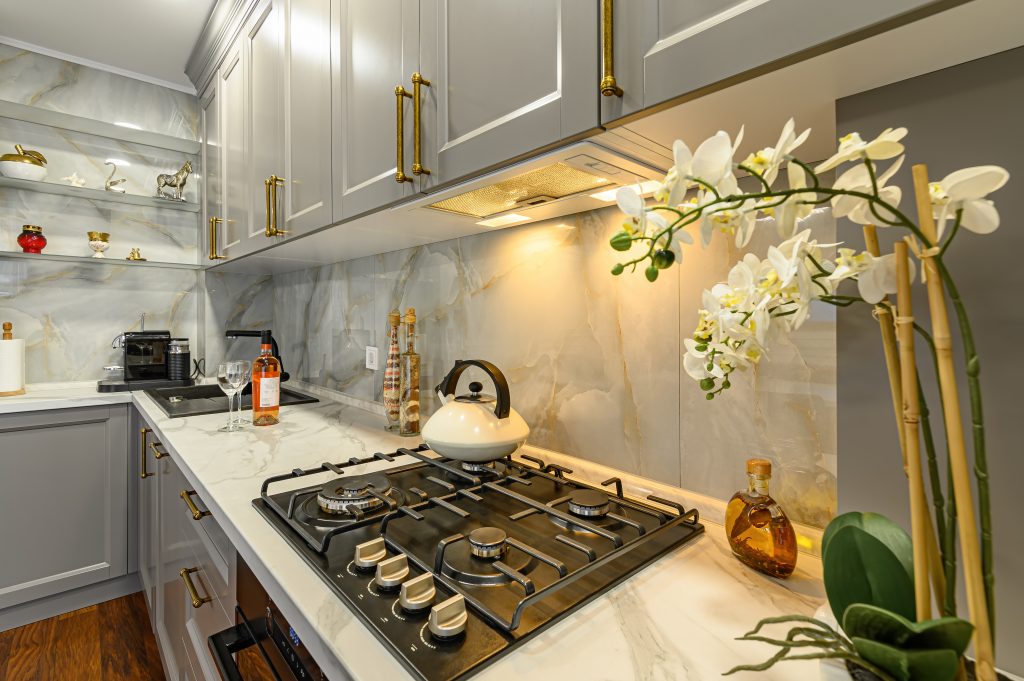 Modern kitchen remodeling services with grey cabinetry and quartz countertops
